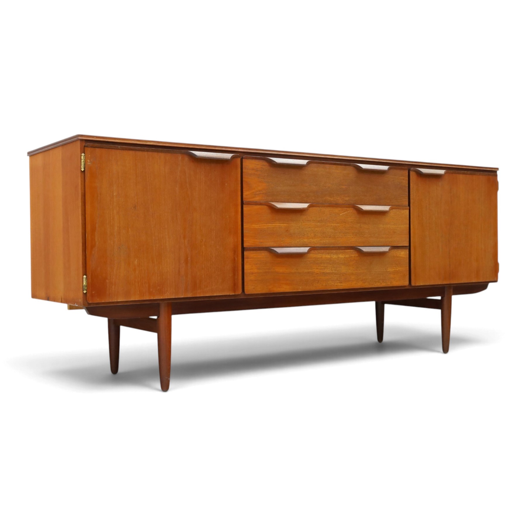 Frank Guille for Austinsuite - mid-20th century teak sideboard, fitted with three central graduating drawers flanked by cupboards, on tapering supports