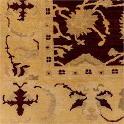 Ziegler design hand knotted wool rug, the rich red ground woven with oversized floral medallions and angular vine scrolls, framed by a contrasting ivory border of repeating floral ornament and minor guard stripes, with fringed ends