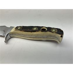 German Puma Skinner knife, the 13cm steel blade marked model 6393, serial No.55472 to guard, fixed blade, antler scales; in original hard plastic case; with brown leather sheath L29cm overall