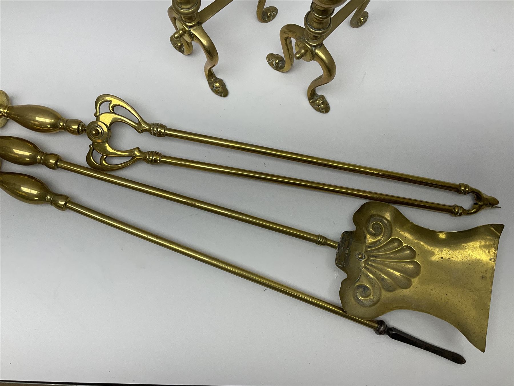 Set of three brass longhandled fire tools, the tongs with Art Nouveau