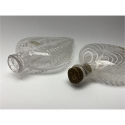 19th century Nailsea glass flask of compressed ovoid form, the clear body with opaque white combed decoration, H21cm, together with another similar example decorated with enamelled stylised bands, H23cm