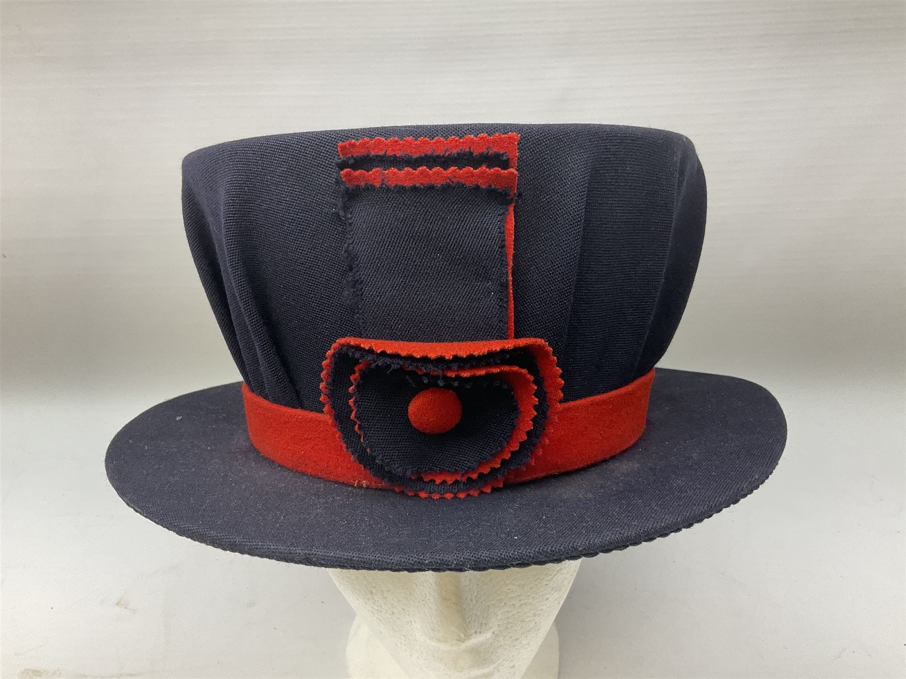 Elizabeth II Yeoman Warders (Beefeater) No.1 Undress blue uniform - comprising tunic bearing label Crown Military Uniforms H.M. Tower of London and bonnet by S. Patey (2) 