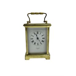 French - 20th century timepiece carriage clock, in a corniche case with carrying handle, enamel dial with Roman numerals, minute track, spade hands and retailers name “Mallory, Bath”, cylinder platform escapement, wound and set from the rear.