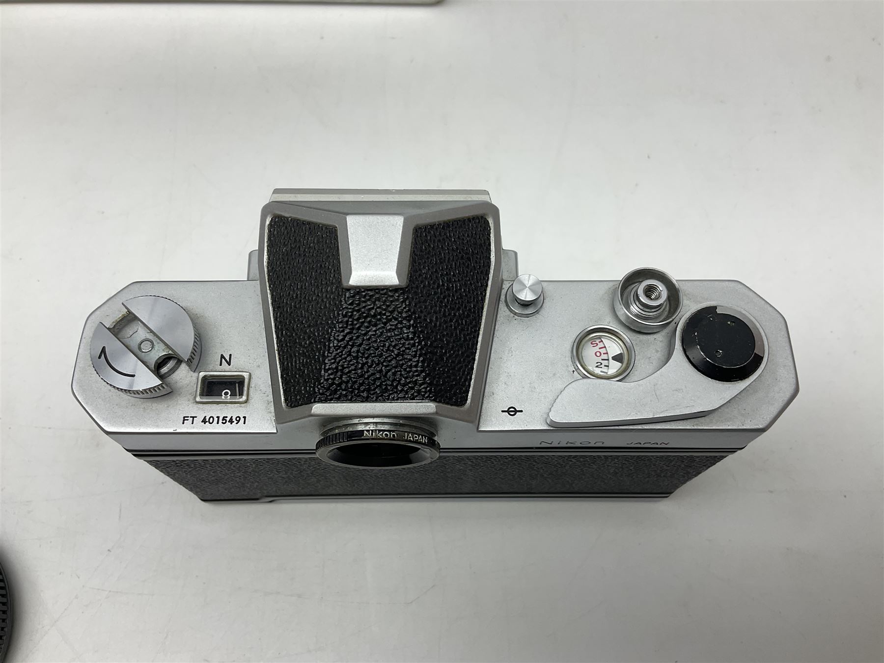Nikkormat FT2 camera body, serial no. 5066813, in original packaging, together with Nikkormat EL camera body, serial no. 5577358, with Nikon Nikkor 50mm 1:1.8' lens no. 2143575, Nikkormat FT, serial no. 3968385, and Nikomat FT camera body, serial no. 4015491