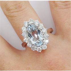 18ct white gold oval aquamarine and round brilliant cut diamond cluster ring, hallmarked, aquamarine approx 2.45 carat, total diamond weight approx 1.20 carat