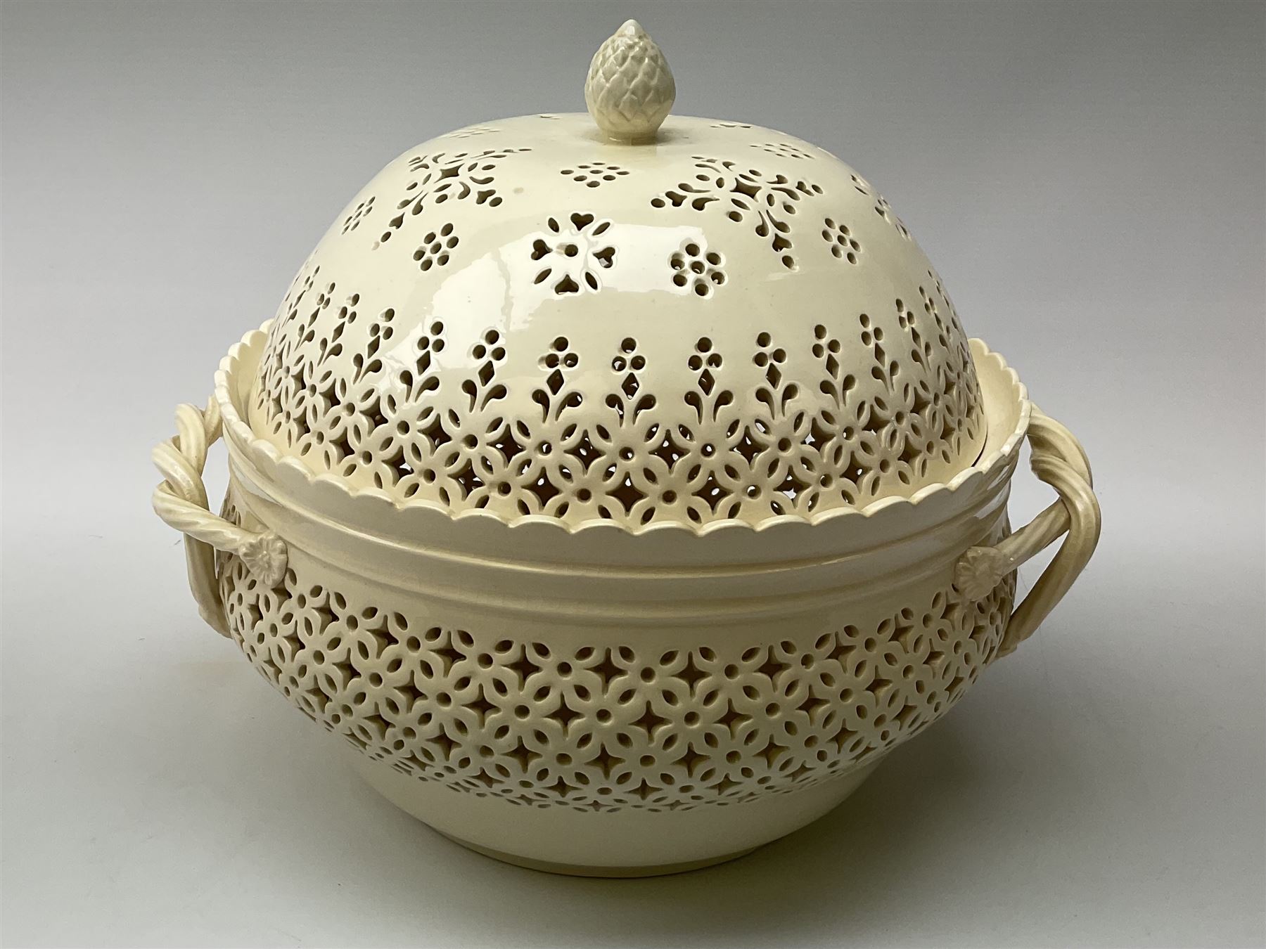 Large 20th century Leeds pottery basket and cover, of bulbous form with pierced detail and twin rope handle, with impressed mark beneath, H23cm D25cm