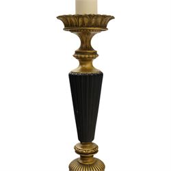 Neoclassical design table lamp, black painted and gilt metal column with fluted central section, foliate and stiff leaf cast decoration, on circular spreading base, fitted with shade frame