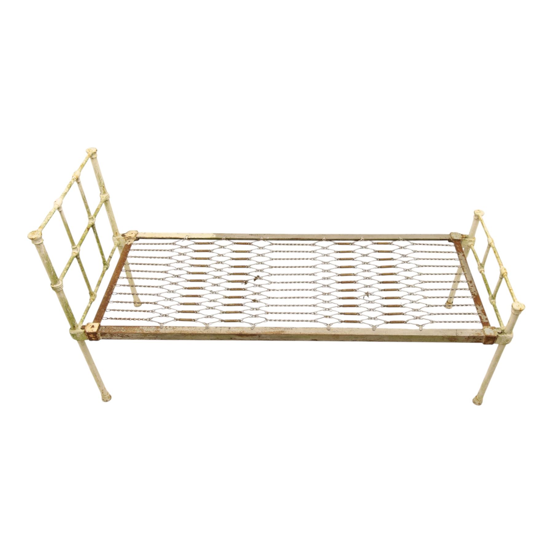 19th century wrought iron single bed, white frame with knot details, frame with wire and spring supports