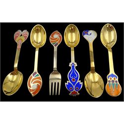 Collection of six Danish silver-gilt year spoons/forks by Anton Michelsen, each with abstract enamel decoration, including tree and bird designs, dated between 1971 and 1979, each stamped A.Michelsen Sterling Danmark and impressed with varying artist signatures