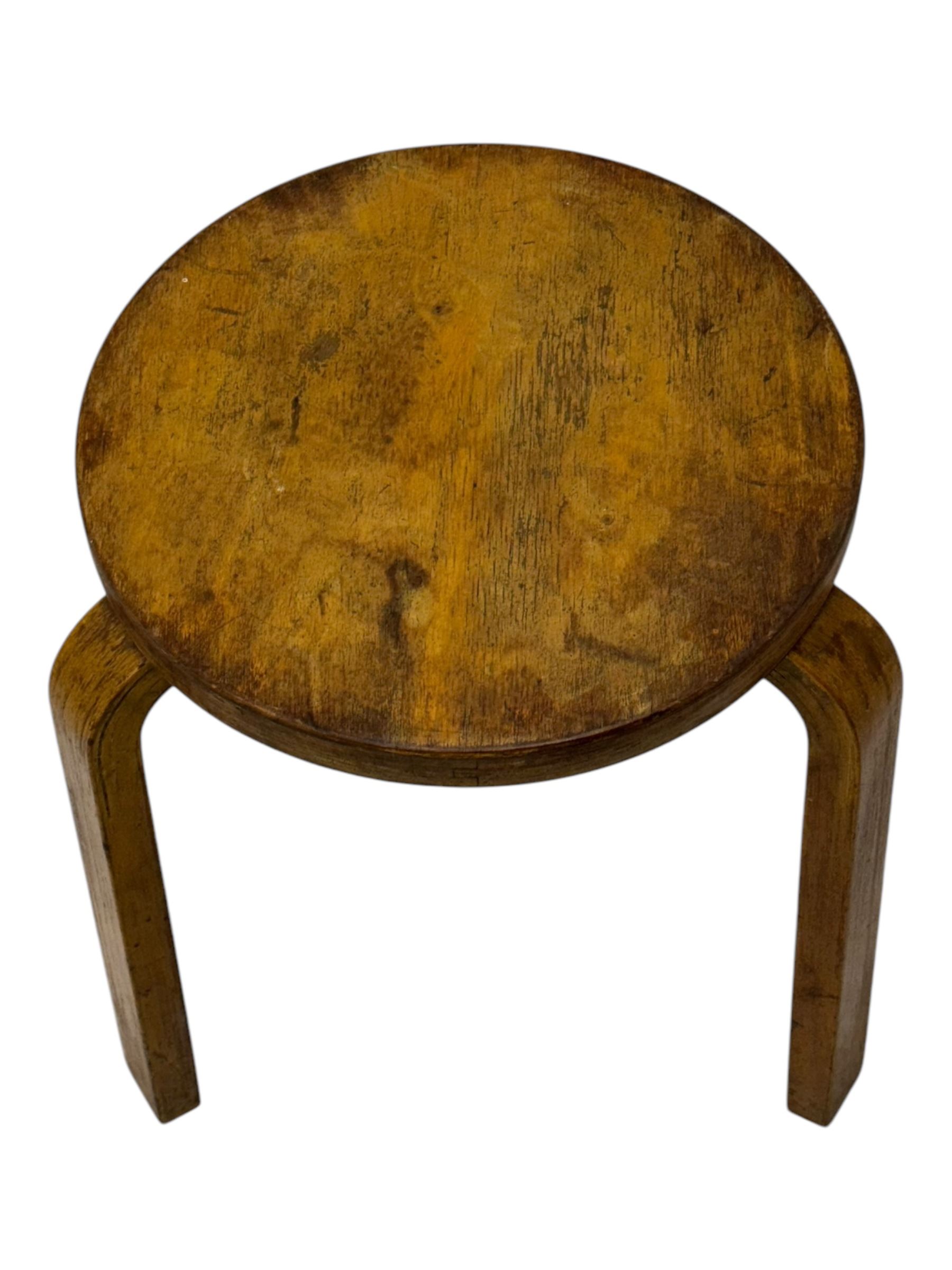 Alvar Aalto for Finmar - mid-20th century Finnish birch circular stool, the seat supported by three bentwood supports, applied label to the underside 