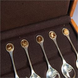 Royal Society for The Protection of Birds silver spoon collection, twelve spoons each inset with a silver-gilt bird cameo, hallmarked John Pinches Ltd, London 1975, in wooden presentation case with certificate of authenticity