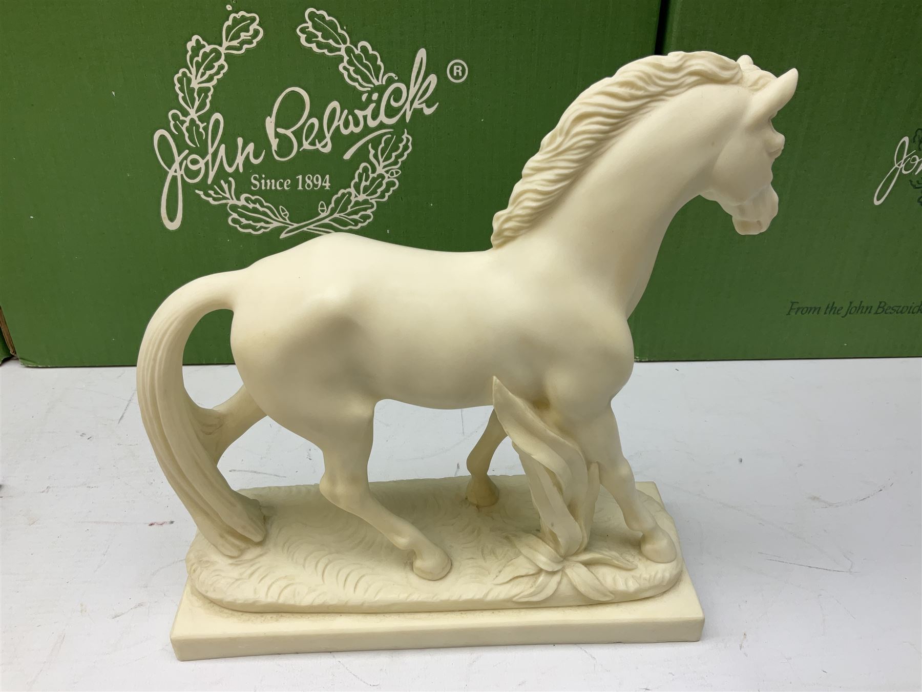 Five Beswick and Royal Doulton horse figures in matt white on black plinths, comprising of  Spirit of Affection no. 2689/2536, Springtime no.2837, Spirit of peace no.2916, Spirit of earth no.2914 and Spirit of the wild no. 183, together with a composite figure of a horse (6)