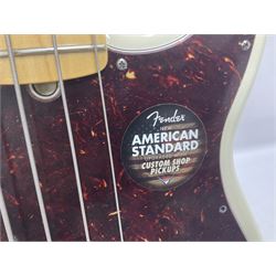 Fender Precision Bass guitar, in Olympic White finish with tortoiseshell effect scratchboard, serial no US15103092, in black Fender hard case with Fender strap and warranty card, guitar L116cm