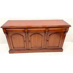 Waring & Gillow cherry wood sideboard, three drawers above three cupboards, platform base