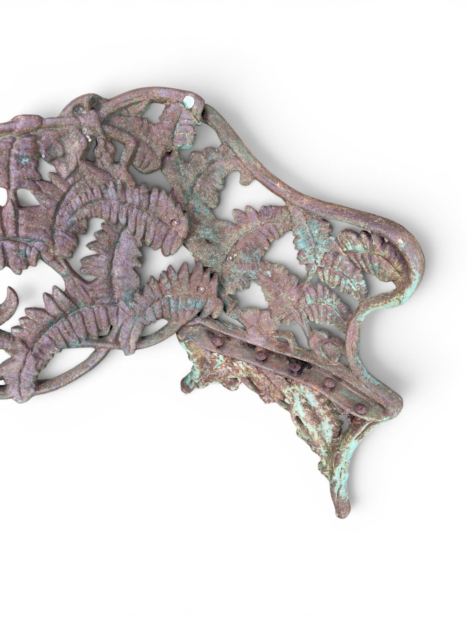 Victorian naturalistic design heavy cast iron garden bench, well defined fern pattern curved back-rest with arms, lacking seat slats for restoration