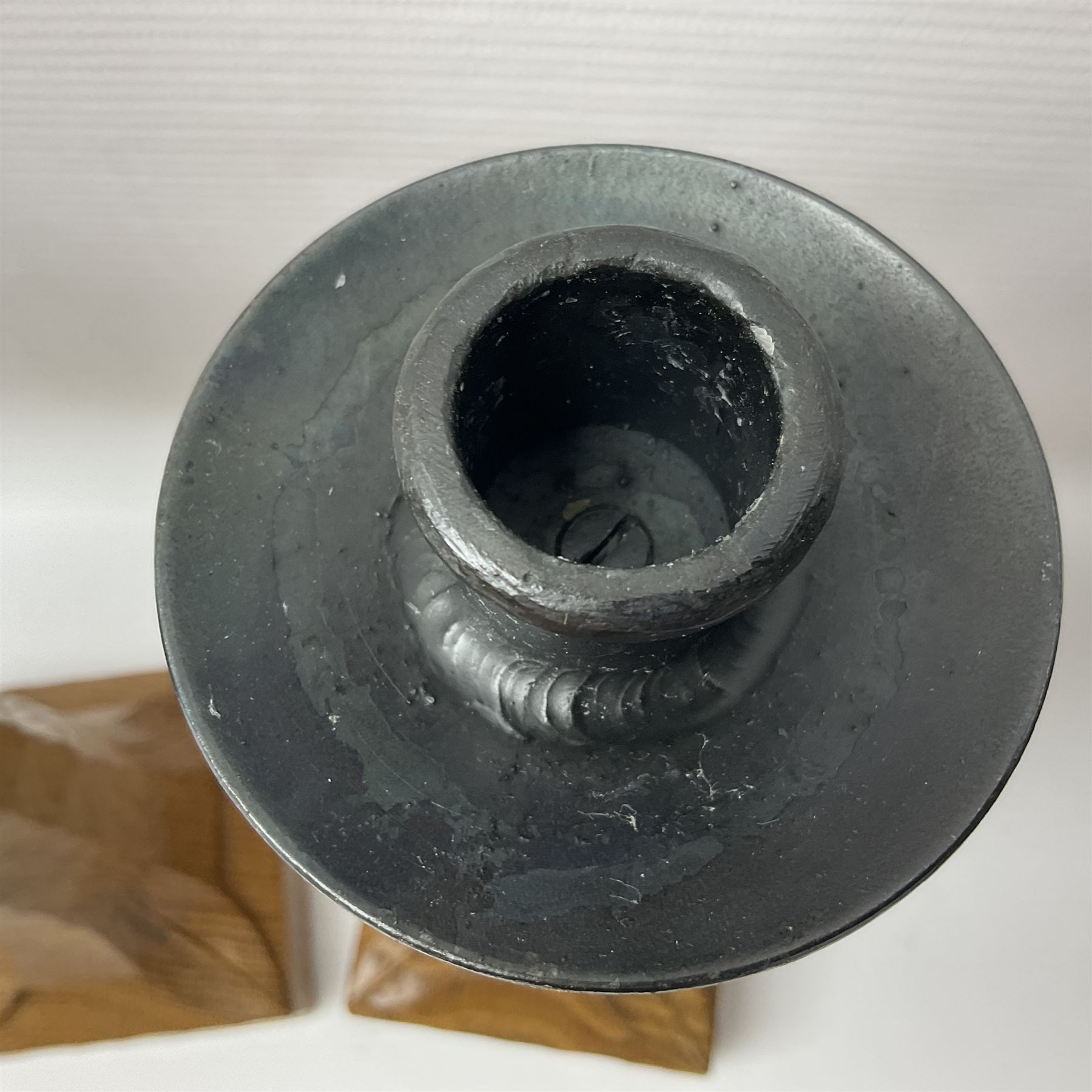 Mouseman - pair of tooled oak candlesticks, wrought iron sconce with drip tray over tapered octagonal column carved with mouse signature, terminating to stylised leaf carved square base, by the workshop of Robert Thompson, Kilburn
