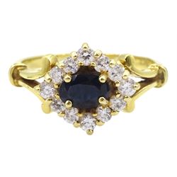 18ct gold sapphire and cubic zirconia marquise shaped ring with scroll shoulders