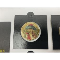 Four gold plated and coloured commemorative fifty pence coins, comprising 2017 Benjamin Bunny, Mr Jeremy Fisher, Tom Kitten and The Tale of Peter Rabbit, with Gold Strike certificate of authenticity