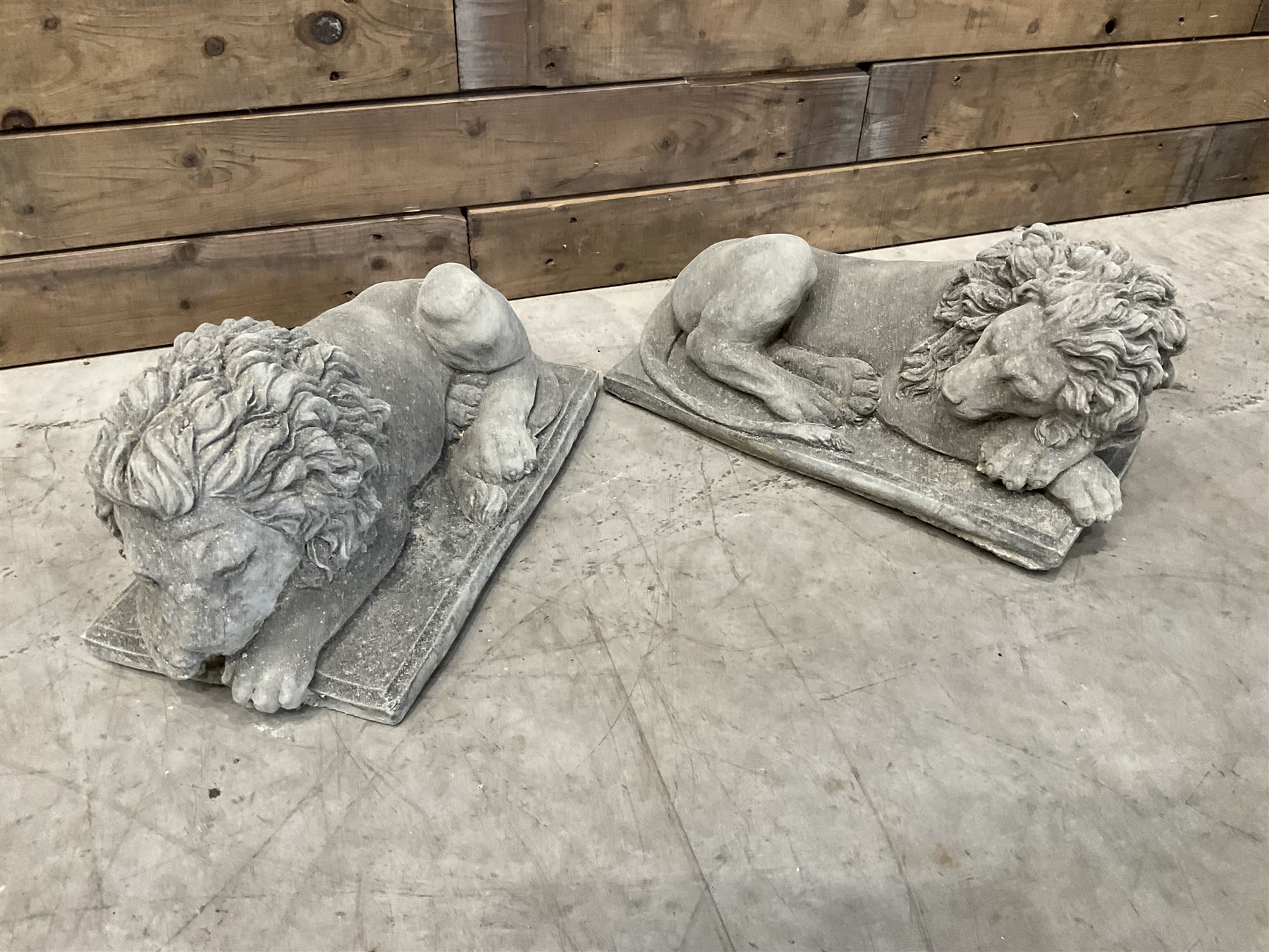 Pair of small recumbent garden lions