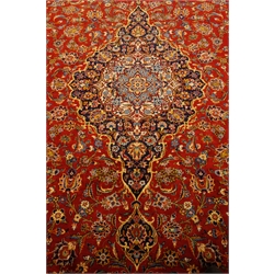  Large Persian Kashan carpet, overall trailing floral design with shaped medallion, decorated with flower heads. repeating guarded border,  436cm x 318cm  