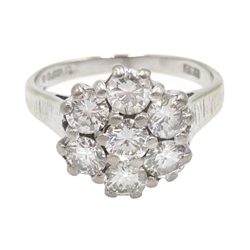  18ct white gold seven stone diamond cluster ring, London 1977  