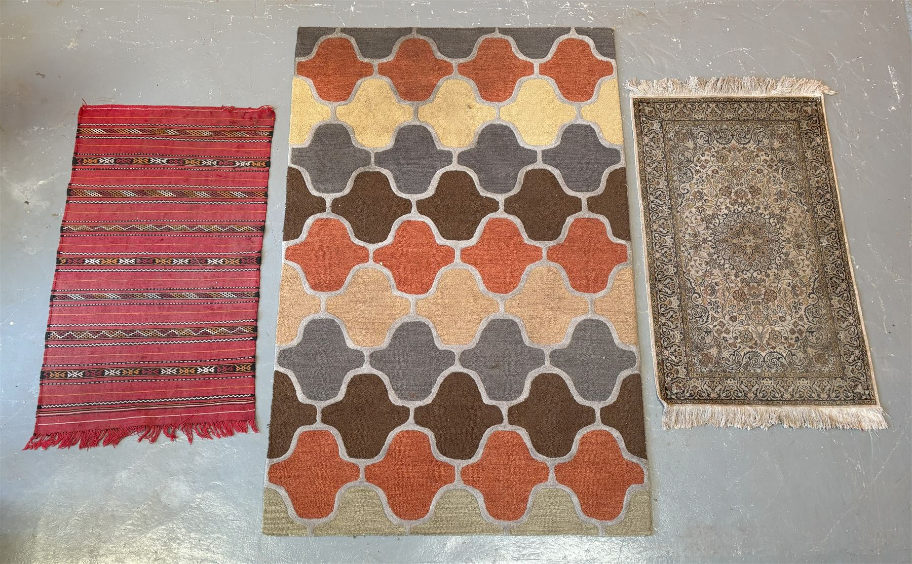 Vintage machine woven rug of repeating design (154cm x 240cm) together with two other vintage rugs (3)