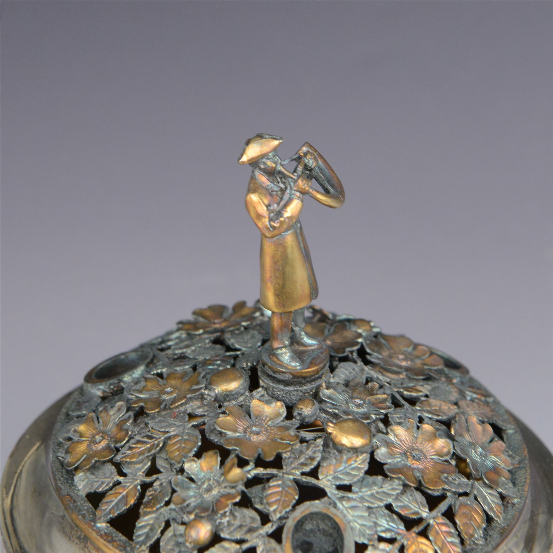 Modern limited edition silver centrepiece 'The Ripon Centrepiece', designed by Hector Miller for Aurum, the plain circular bowl with removable pierced parcel gilt lid, decorated in relief with flowers and foliage, the finial modelled as a hornblower, limited edition no. 41/150, hallmarked Hector Miller, London 1986, H15cm, boxed with certificate