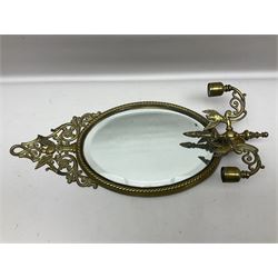 Brass oval girandole wall mirror, with openwork pediment above a bevelled mirror plate