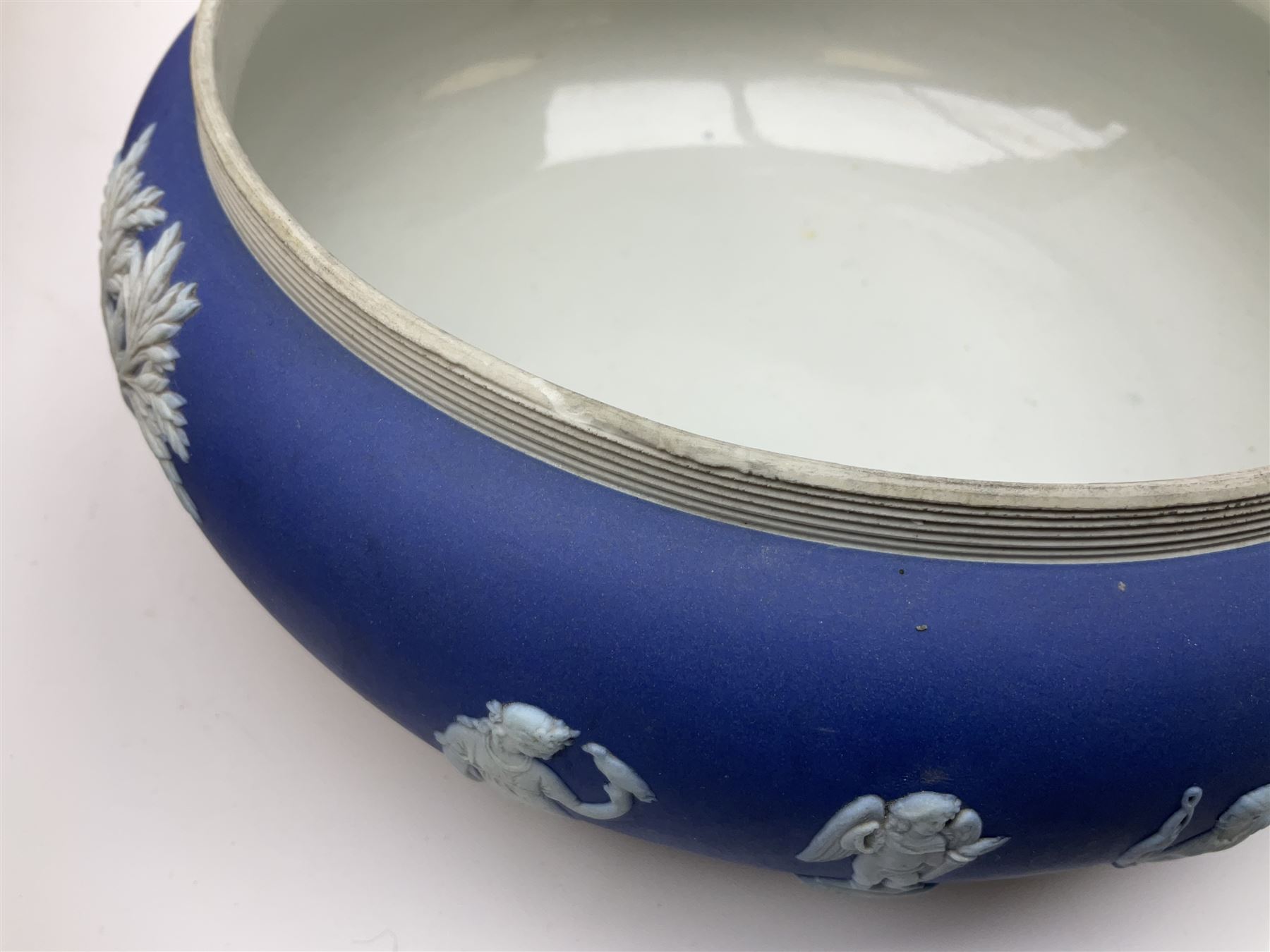 Two Royal Crown Derby pattern Imari soup bowls, pattern 2451, Belleek Fermanagh Ireland four piece set in green shamrock pattern, Royal Doulton small lady figure, Marie HN1370, large Wedgwood fruit bowl, Sylvac jardiniere in autumn leaves pattern, five pieces Co-operative Society commemorative ceramics, with selection of other ceramics. 