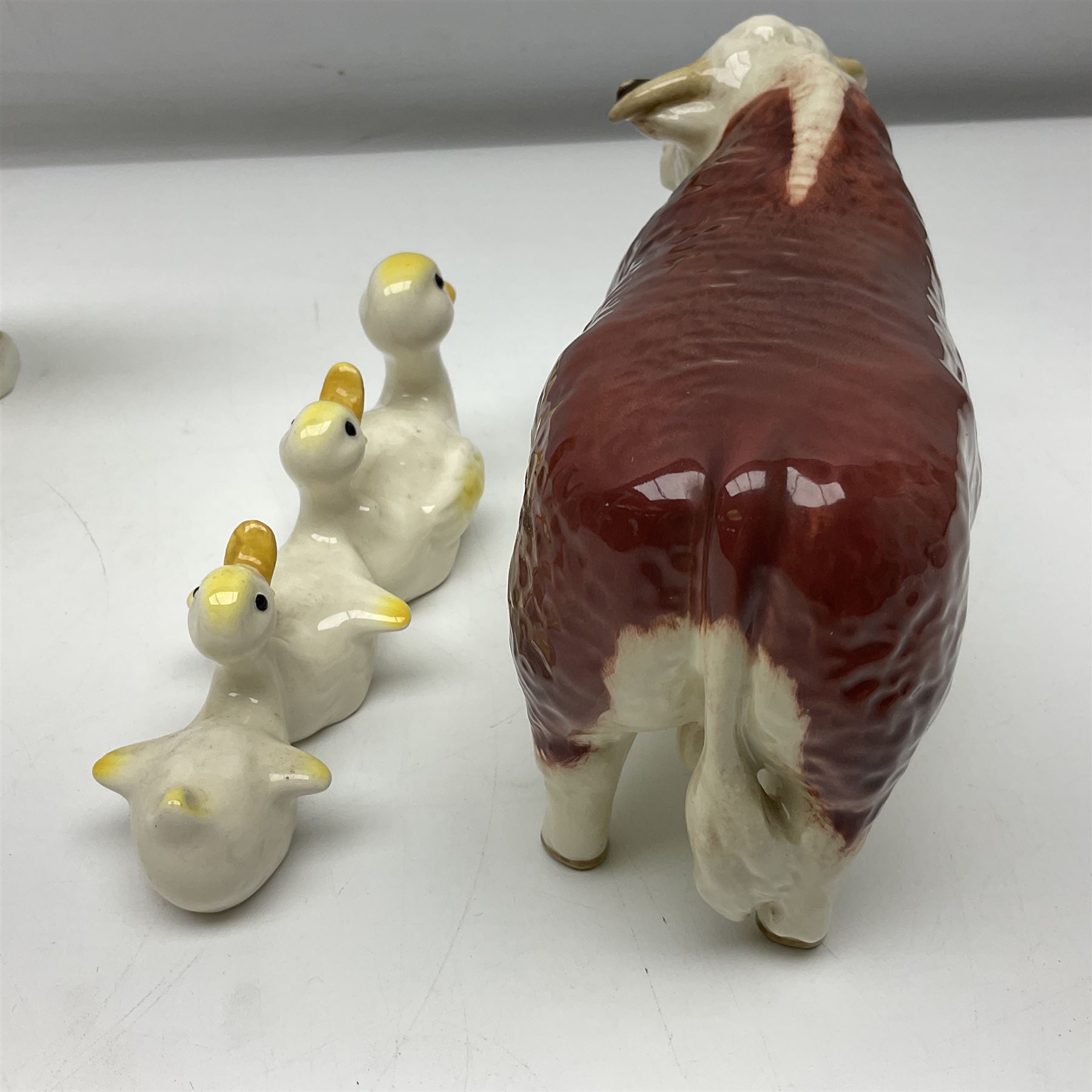 Beswick Champion of Champions Hereford bull figure no 1360, Beswick Norman Thelwell An Angel on Horseback no 2704A, and three other Beswick figures to include Arab Bay horse, Mallard and Comical Duck Family, all with printed or impressed marks beneath, largest H17.5cm