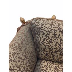Contemporary Knole type two seat ‘snuggler’ drop arm sofa, upholstered in brown fabric with raised foliate pattern 