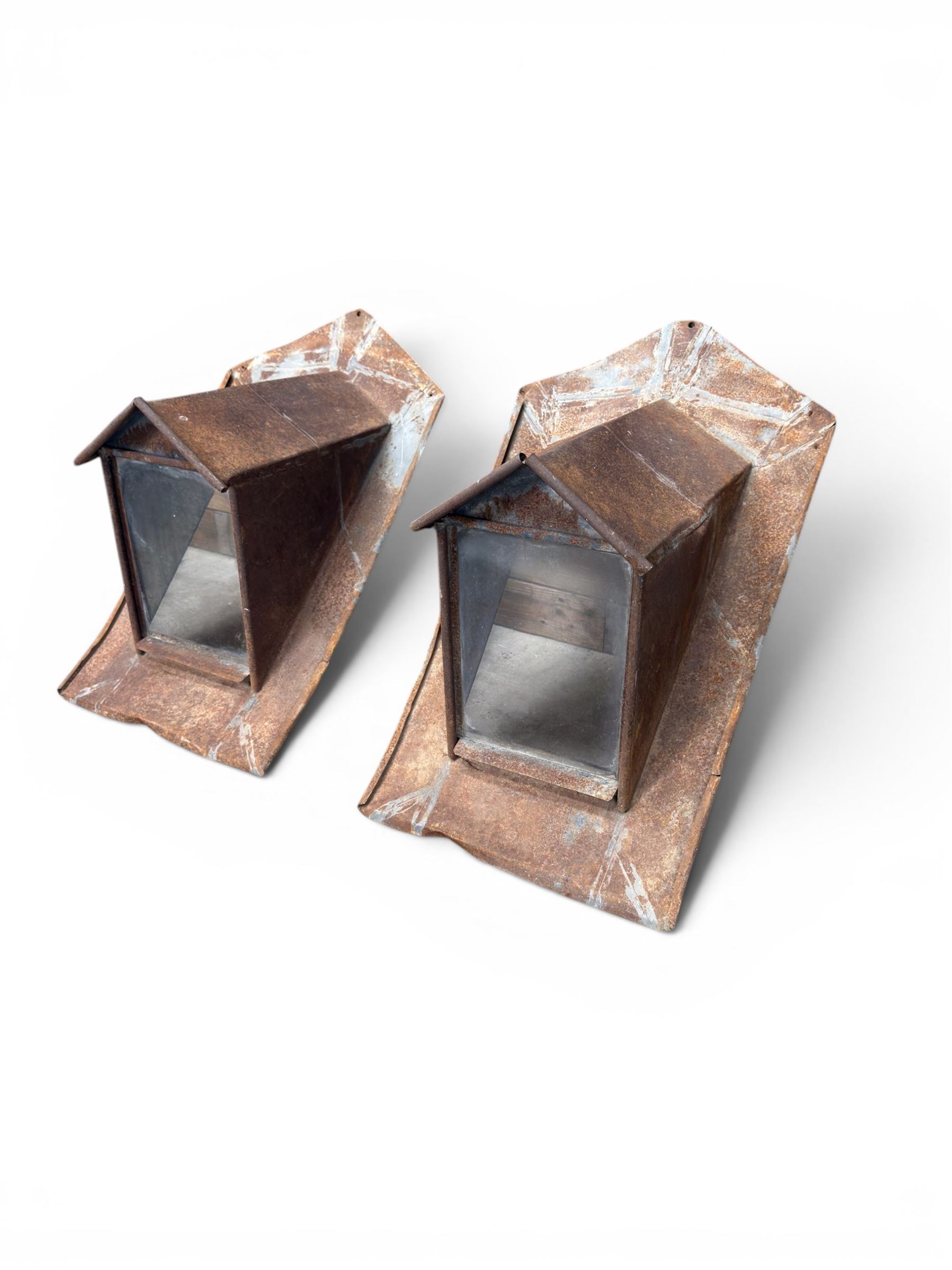 Pair of metal sloping roof lanterns with glazed windows
