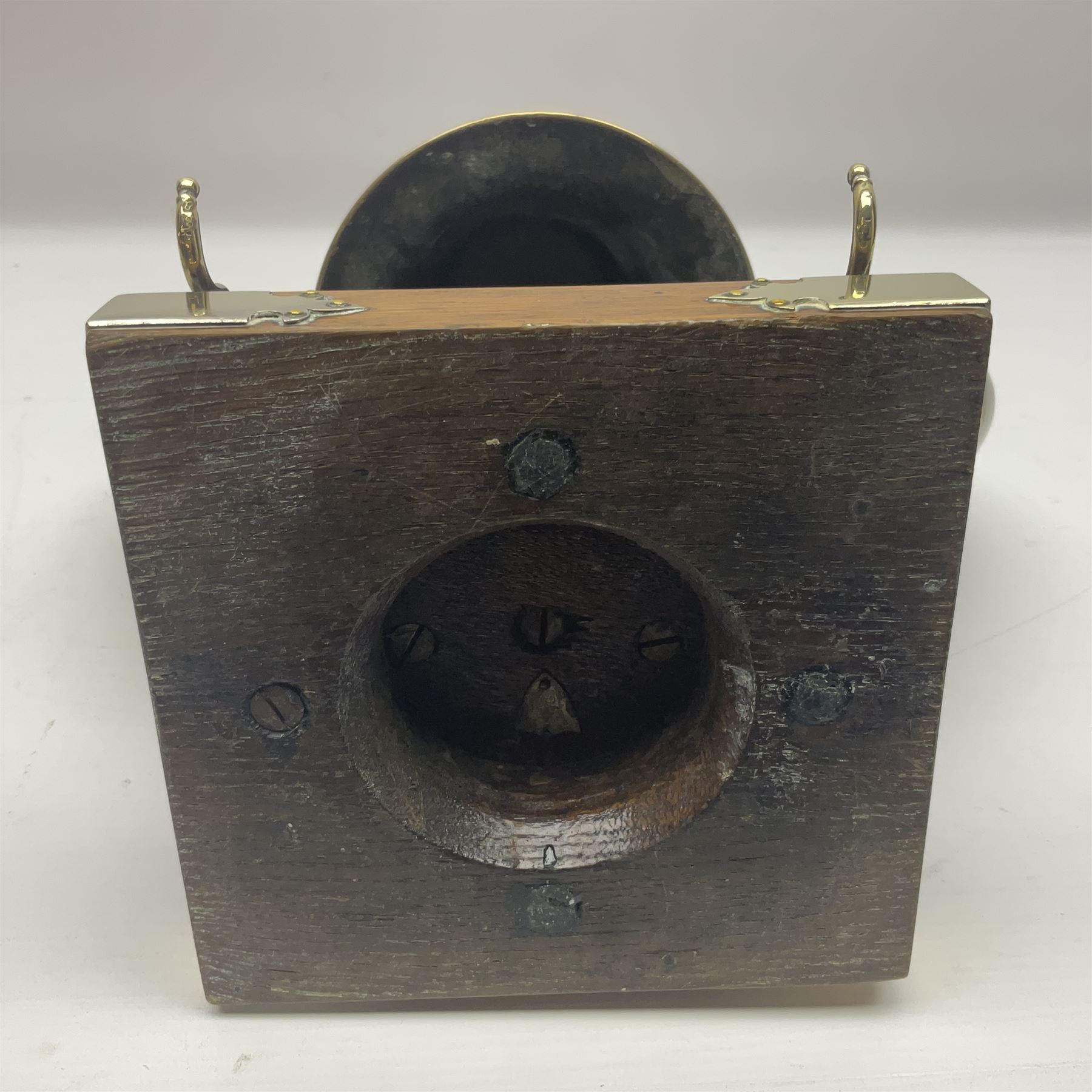 Early 20th century oak and horn dinner bell, the silvered bell suspended from a pair of cow horns, with silver plated mounts and blank shield shaped cartouche, upon square base, H37cm