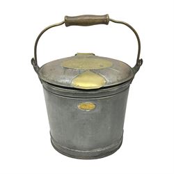 Late 19th/early 20th century steel and brass dairy pail or can, of oval form with swing handle, brass plaque to front and hinged cover inscribed 'F & T Ross Ltd Dairy Outfitters Hull', and 'New Milk F Clappison Dairy Farmer Hull', not including handle H30cm