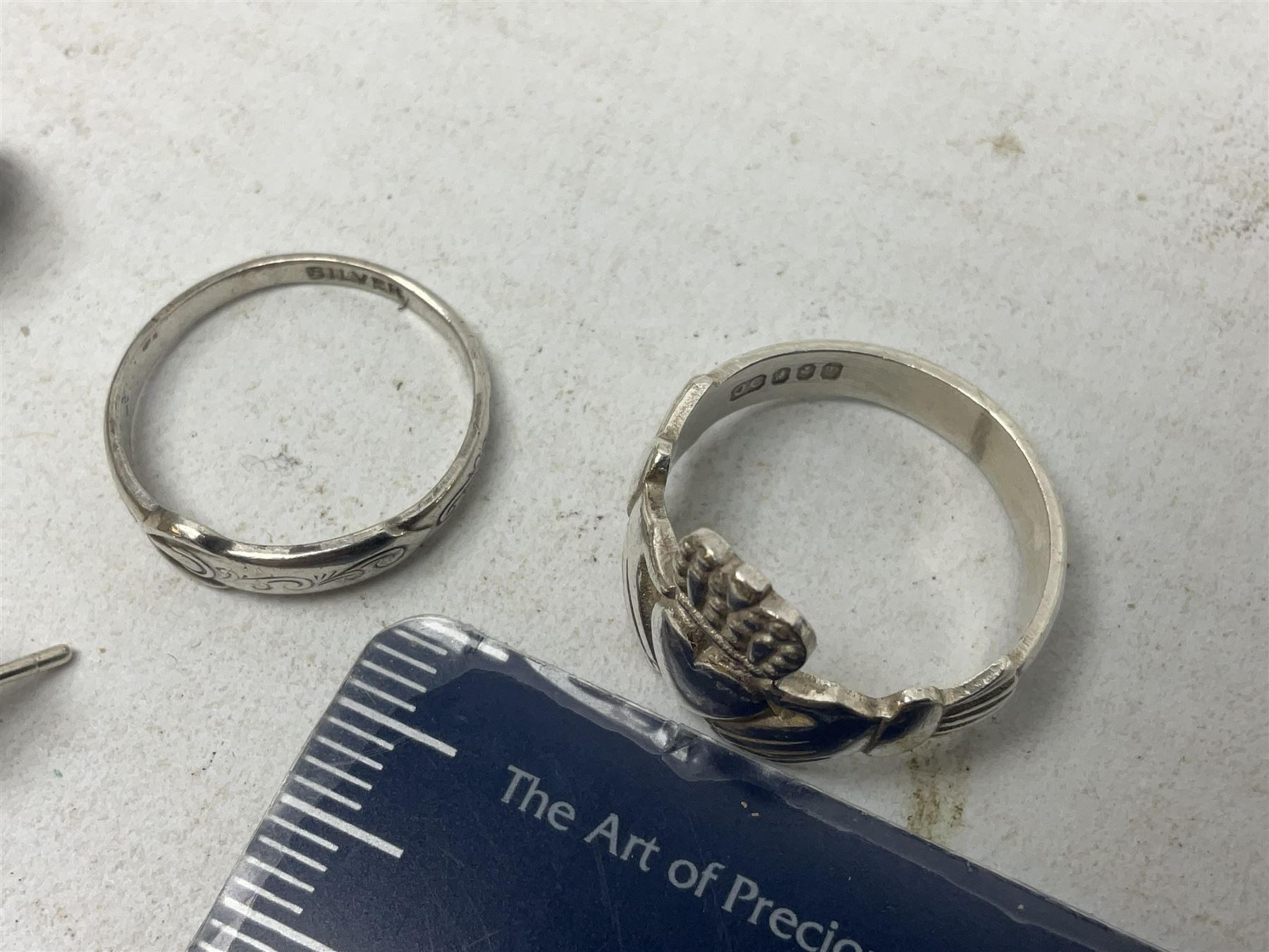 Silver mother of pearl handled fruit knife, silver jewellery including masonic pendant necklace, shell pendant, coin ring, Claddagh ring and charms etc, and a collection of ingots