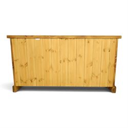 Indigo Furniture - large rustic oak chest, rectangular top fitted with six drawers with metal pull handles, on skirted base
