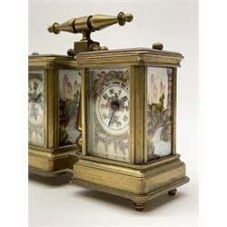 Brass and bevelled glass cased carriage timepiece clock and barometer, with painted porcelain panels depicting floral garlands and country scenes, the timepiece with Roman dial and single train driven movement, aneroid barometer with Arabic register, central pillar supporting handle