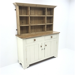 White painted and waxed pine dresser, two drawers and two cupboards, raised two heights plate rack, W141cm, H178cm, D48cm