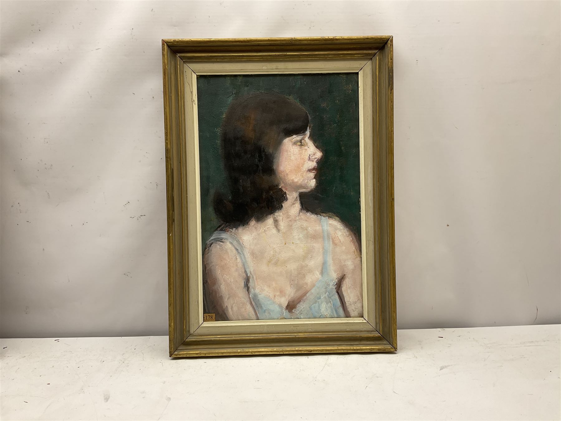 Madeline A Manton (Mid 20th century): 'Jaqueline' bust portrait, oil on board, titled with artist's address 124 Kings Road London on Chelsea Artists exhibition label verso 49cm x 32cm
