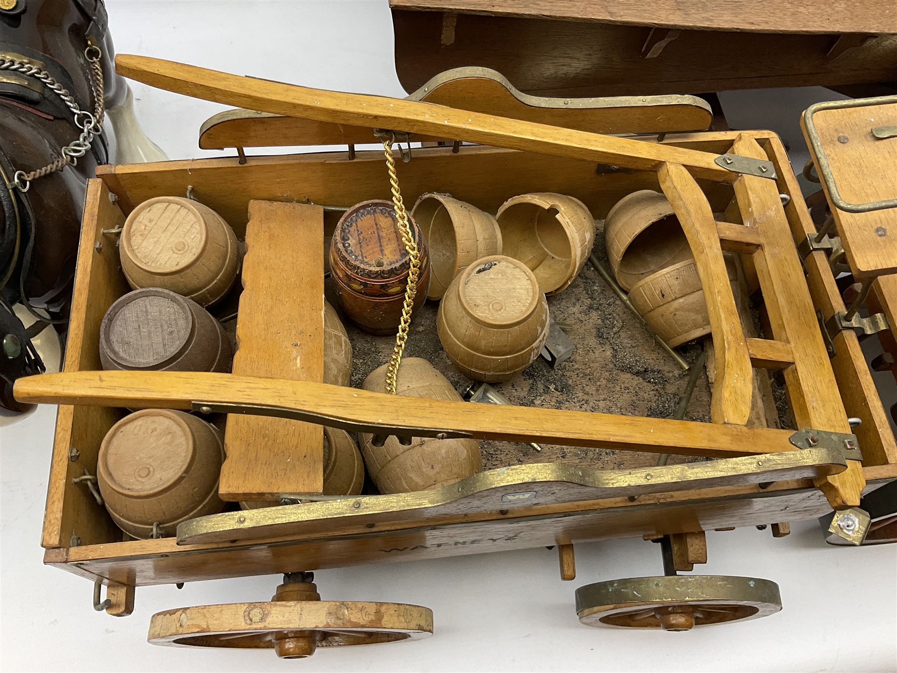 Four Melba Ware Shire horse figures and another similar, and three wood carts