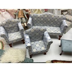 Doll's house soft furnishings - including quality three-piece suite, settee, pair of wing armchairs, window seat, armchair and matching footstool, dining chairs, corner chair, three beds, quantity of rugs, four dolls etc