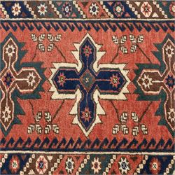 Caucasian Kazak rug, red field with three bold geometric medallions in dark blue, cream and brown, scattered tribal motifs, broad indigo border decorated with stylised hooked forms and multiple narrow patterned borders