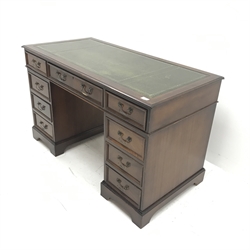 Georgian style mahogany twin pedestal desk, green leather inset top, nine drawers, shaped plinth base, W123cm, H75cm, D61cm