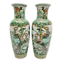 Pair of Chinese famille verte vases of baluster form decorated with phoenixes and birds in a floral garden, H31cm