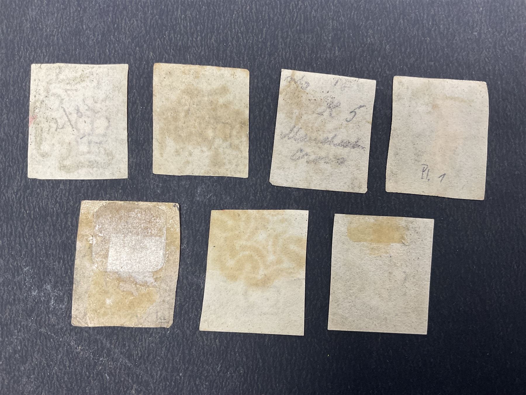 Seven Great Britain Queen Victoria penny black stamps, three with black and four with red MX cancels