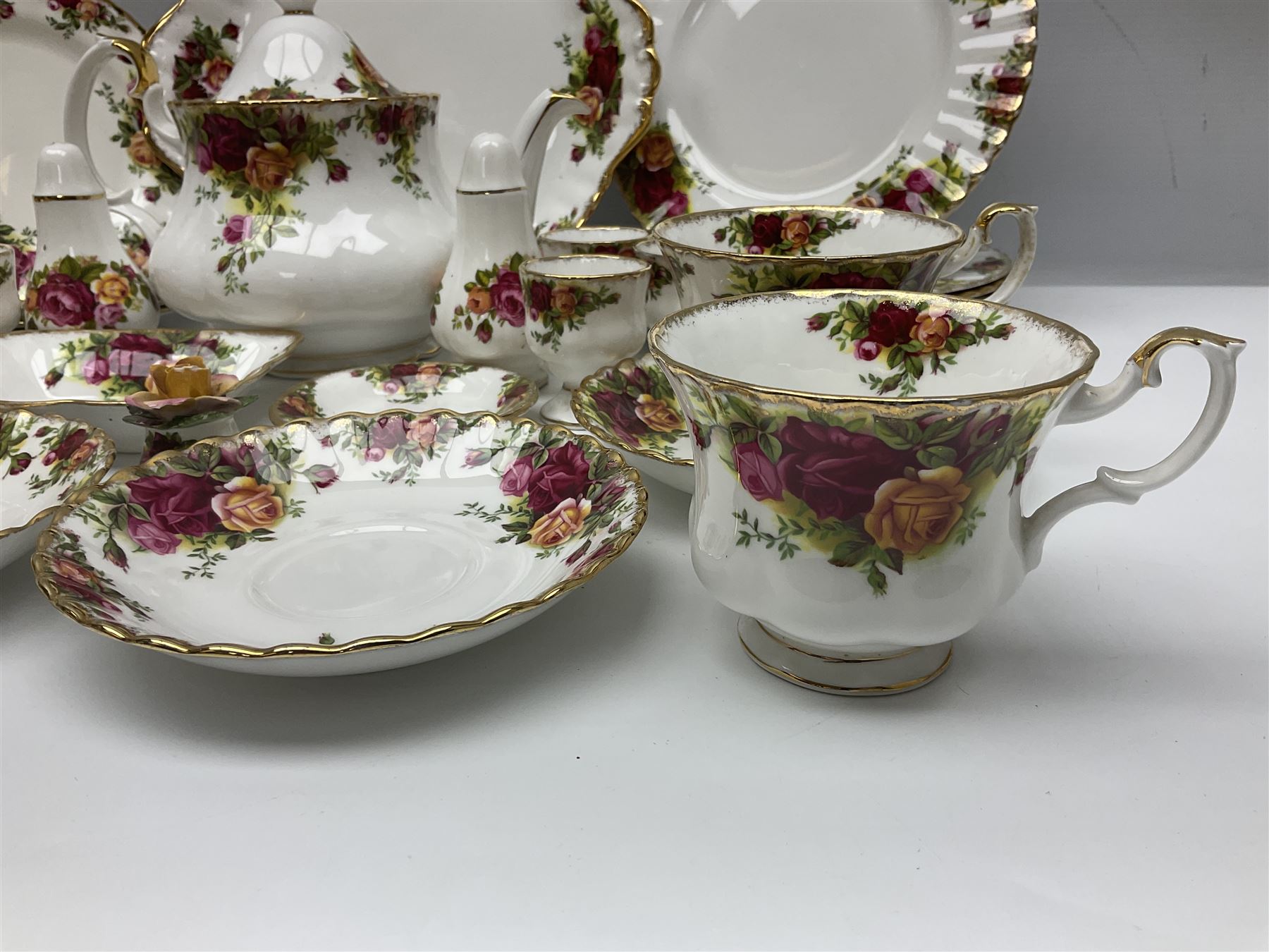 Royal Albert Country Roses pattern part tea and dinner service, to include teapot, four cups and saucers, four dessert plates, cake plate etc, (41)
