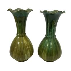 Pair of green glaze Bretby vases of bulbous form with a tulip necks, with impressed mark beneath, H24cm