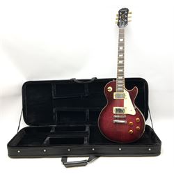 1980s Les Paul Epiphone limited edition cut-away electric guitar by Gibson, the burgundy coloured body with two pick-ups, volume and tone knobs and scratch plate, original tuning pegs, serial no.U6030215, 101cm overall; in modern Kinsman fitted carrying case