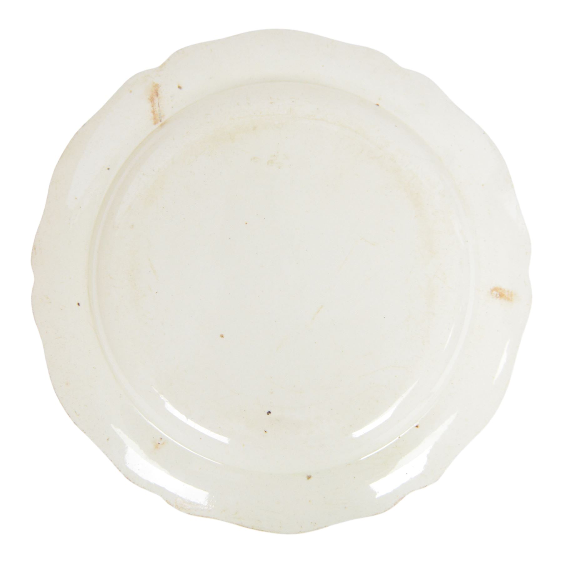 Late 18th century named creamware plate with black printed decoration, of circular form with shaped rim, inscribed to the centre 'Henry Gittings' within a foliate a C scroll surround, the rim detailed with floral sprigs, D24cm