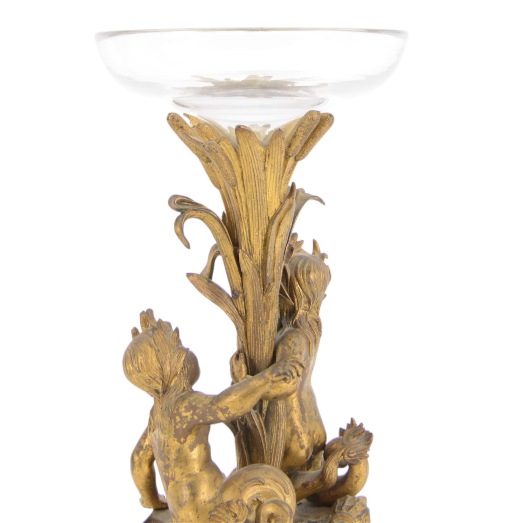 19th century French bronze ormolu centrepiece, the stem cast in relief with reeds holding aloft a glass bowl, supported by two mermen upon a naturalistic base, including bowl H38cm